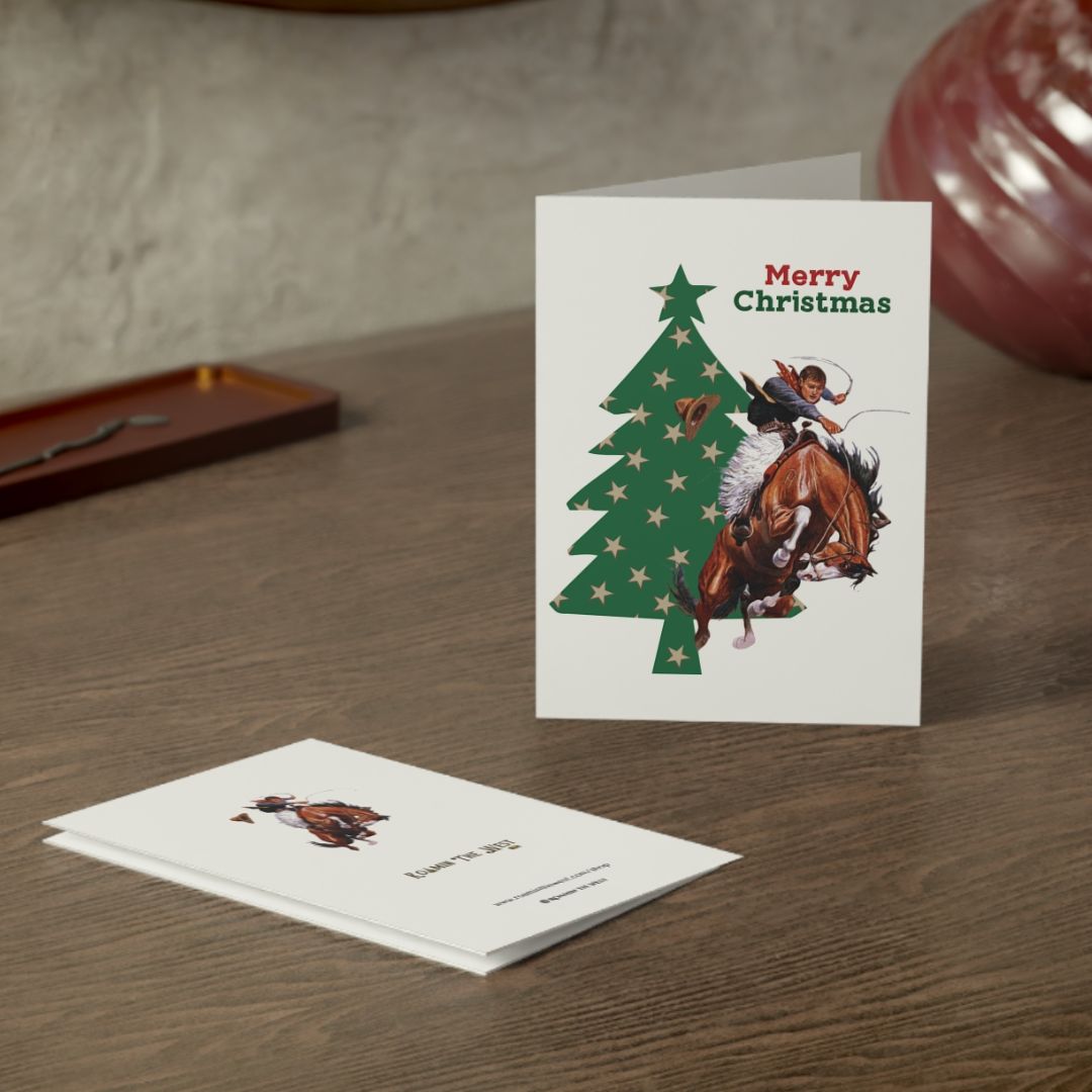 Christmas card with horse and rider design on a wooden surface